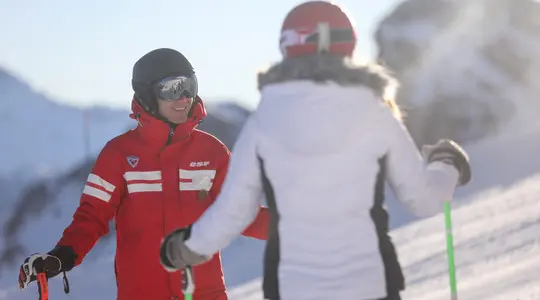 Student building confidence on skis with a Mauna Kea instructor in Hokkaido
